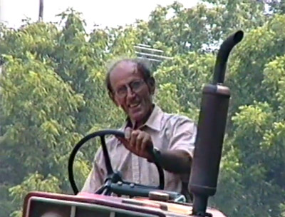 Tim Anagnostis riding tractor at Decker Farm, close up