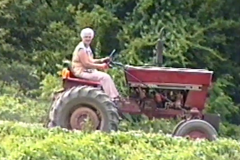 Aunt Honey riding tractor
