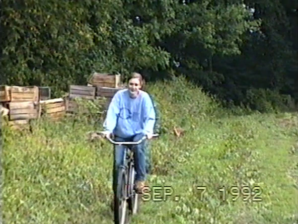 Mary riding bike on farm